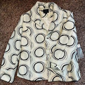 Cream and black water repellent dress jacket.